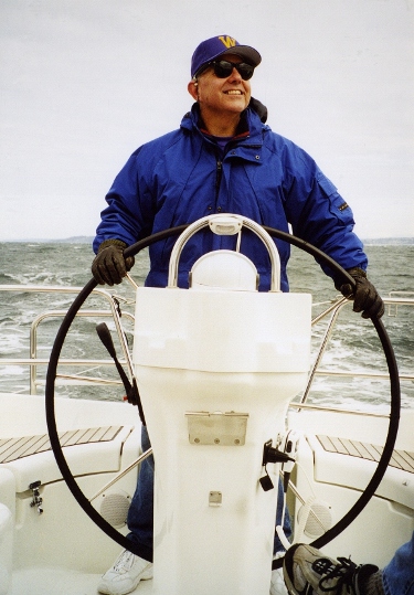 Captain Boyer at the helm of his sailboat.
