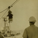 USCGC Winnebago highlining a crewman to another ship.