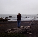 Ron Marlett taking photographs of the beach.