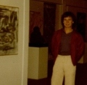 Ron Marlett next to his abstract painting.
