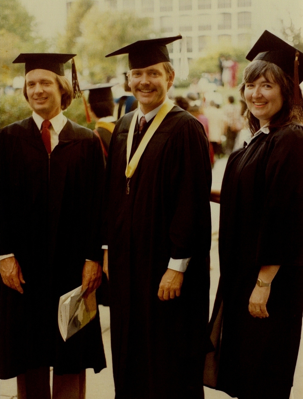 Ron Marlett with his brother and sister at graduation.