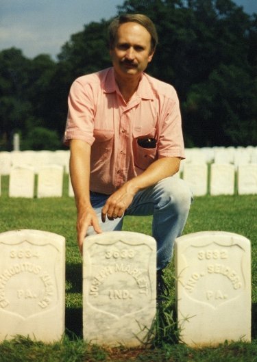 Ron Marlett's brother Rob near a relative's grave.