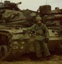 Ron Marlett's brother Rich standing guard near his tanks.