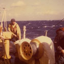 Ron Marlett lowering the port small boat aboard the USCGC Winnebago.