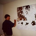 Ron Marlett working on his painting.