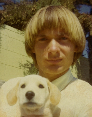 Rob Marlett holding a puppy.