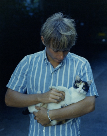 Ron Marlett holding a cat in Hawaii.