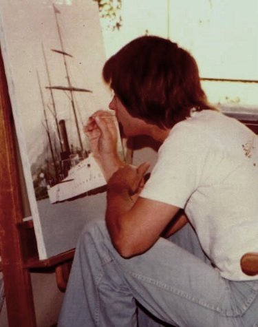 Ron Marlett working on a maritime painting.