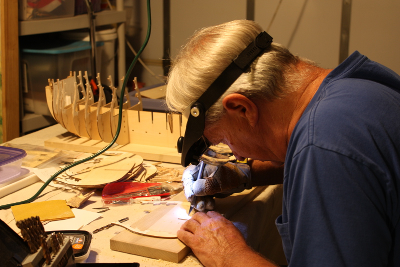 Ron Marlett working on his model ship.