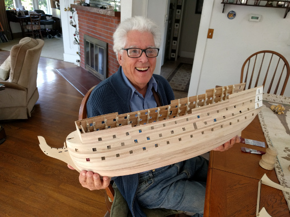 John Mack holding the HMS Victory.